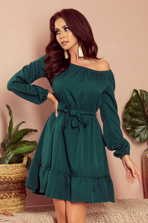 A stylish off-the-shoulder green dress with long sleeves and a waist tie, perfect for a chic and elegant look. The dress features a ruffled hem, adding a touch of femininity and flair.