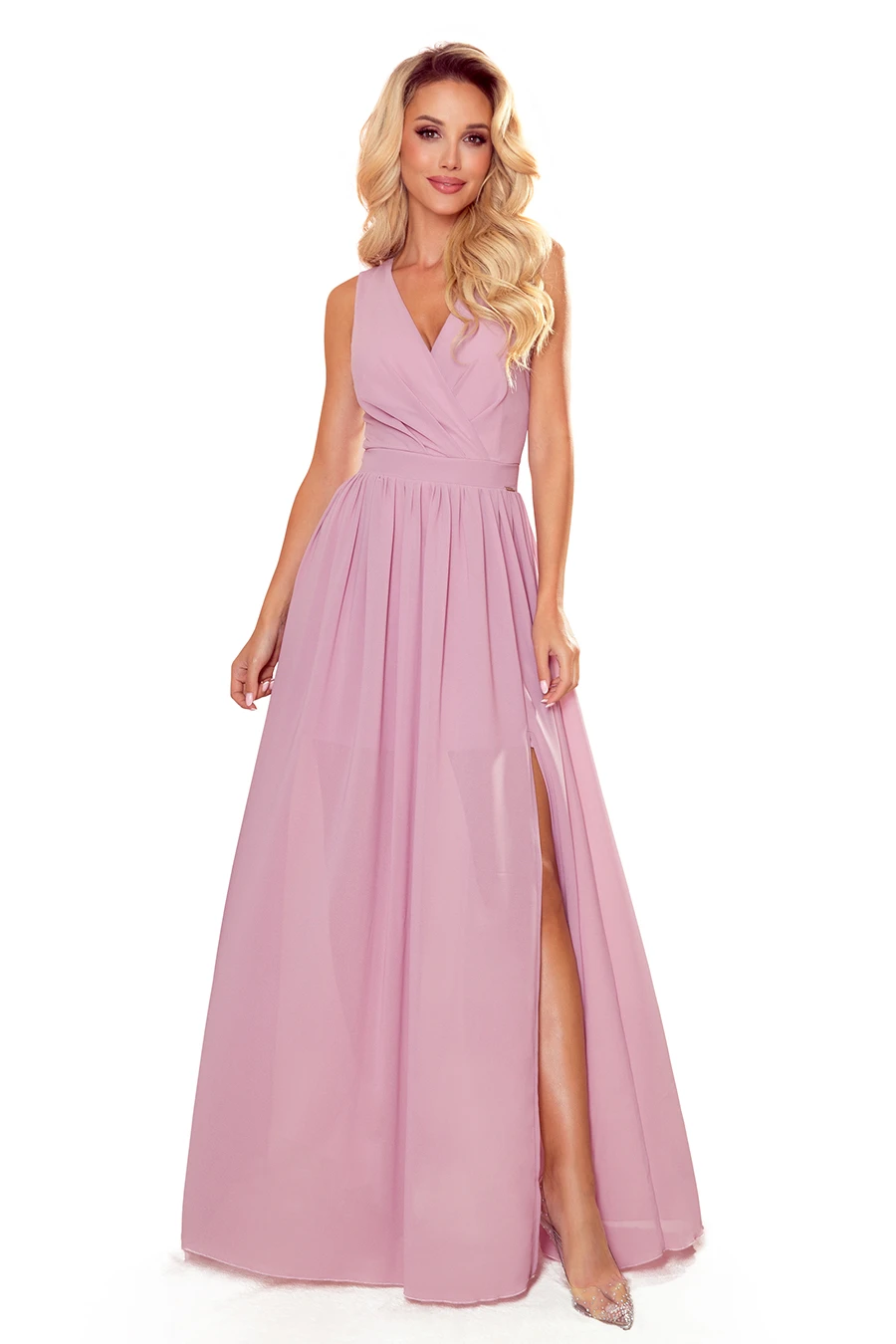 A long, elegant pink dress with a sleeveless design and a deep V-neckline, featuring a flowing skirt with a high slit. The dress is perfect for formal occasions, offering a sophisticated and graceful look.