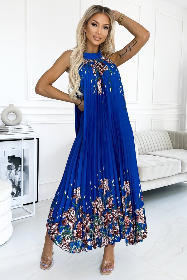 A vibrant blue maxi dress features a pleated design with a floral pattern at the hem, creating an elegant and flowing silhouette. The sleeveless style and high neckline add a touch of sophistication, perfect for both casual and formal occasions.