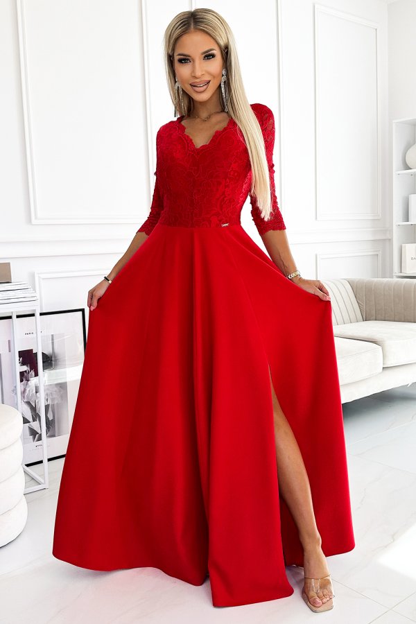 A stunning red evening gown with intricate lace detailing on the bodice and a flowing skirt. The dress features a flattering V-neckline and three-quarter sleeves, perfect for elegant occasions.
