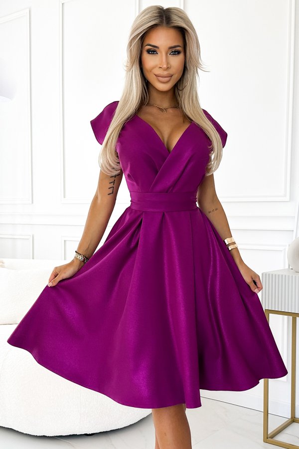 The image features a vibrant magenta dress with a flattering V-neckline and cap sleeves, perfect for elegant occasions. The dress is cinched at the waist, creating a graceful silhouette with a flowing skirt.