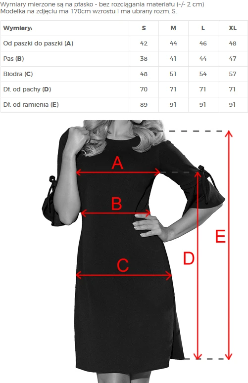 A black dress with three-quarter sleeves features elegant tie details at the cuffs. The image includes measurement lines indicating various dimensions of the dress for size reference.