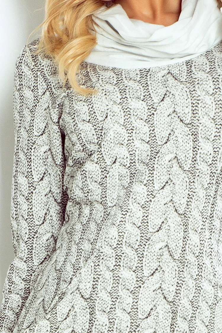 The image features a cozy, light gray cable-knit sweater with a soft, textured pattern. It is complemented by a matching white scarf, adding a touch of elegance and warmth.