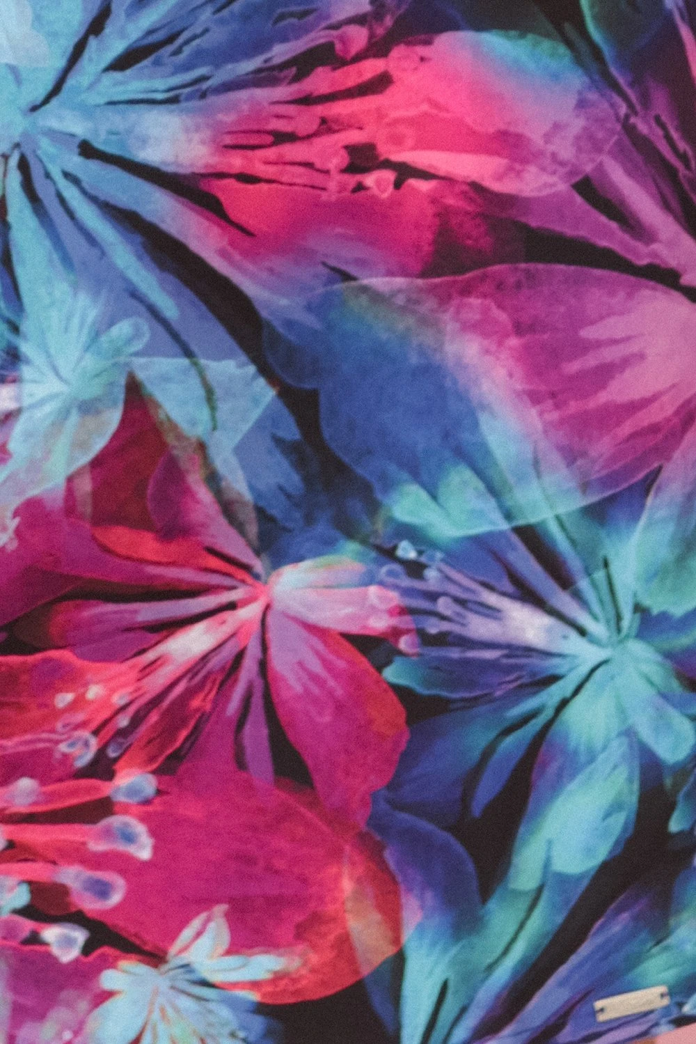 The woman in the photo is wearing a vibrant floral dress, showcasing the colorful patterns of the floral dress. The model highlights the dress\'s elegant design and comfortable fit, perfect for any occasion.