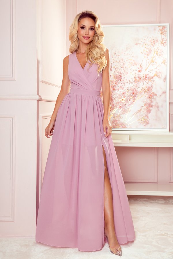 A long, elegant pink dress with a deep V-neckline and a high slit, perfect for formal occasions. The dress features a fitted waist and flowing skirt, adding a touch of sophistication and grace.