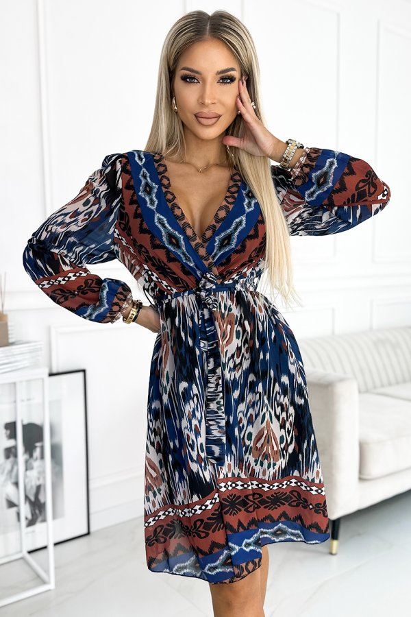 A stylish, long-sleeved dress featuring a vibrant, multicolored geometric pattern with a flattering V-neckline and a cinched waist. The lightweight fabric and bold design make it perfect for both casual and formal occasions.