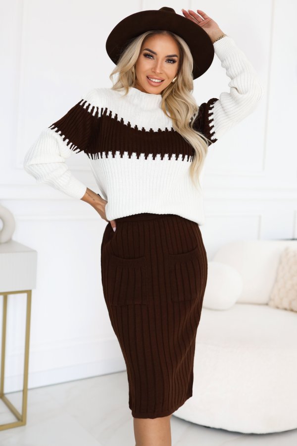 The image showcases a stylish two-piece knitted set featuring a white and brown design, complete with a fitted skirt and matching top. This versatile two-piece set is perfect for a chic and cozy look.