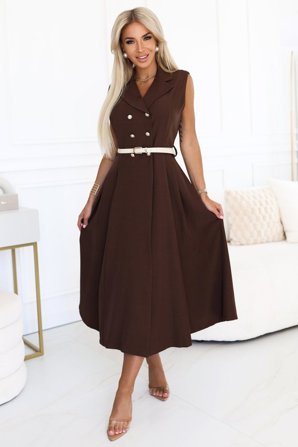 The woman in the photo is wearing a chic brown sleeveless midi dress, accentuated with a stylish white belt. This elegant ensemble highlights the versatility of the brown midi dress for both casual and formal occasions.